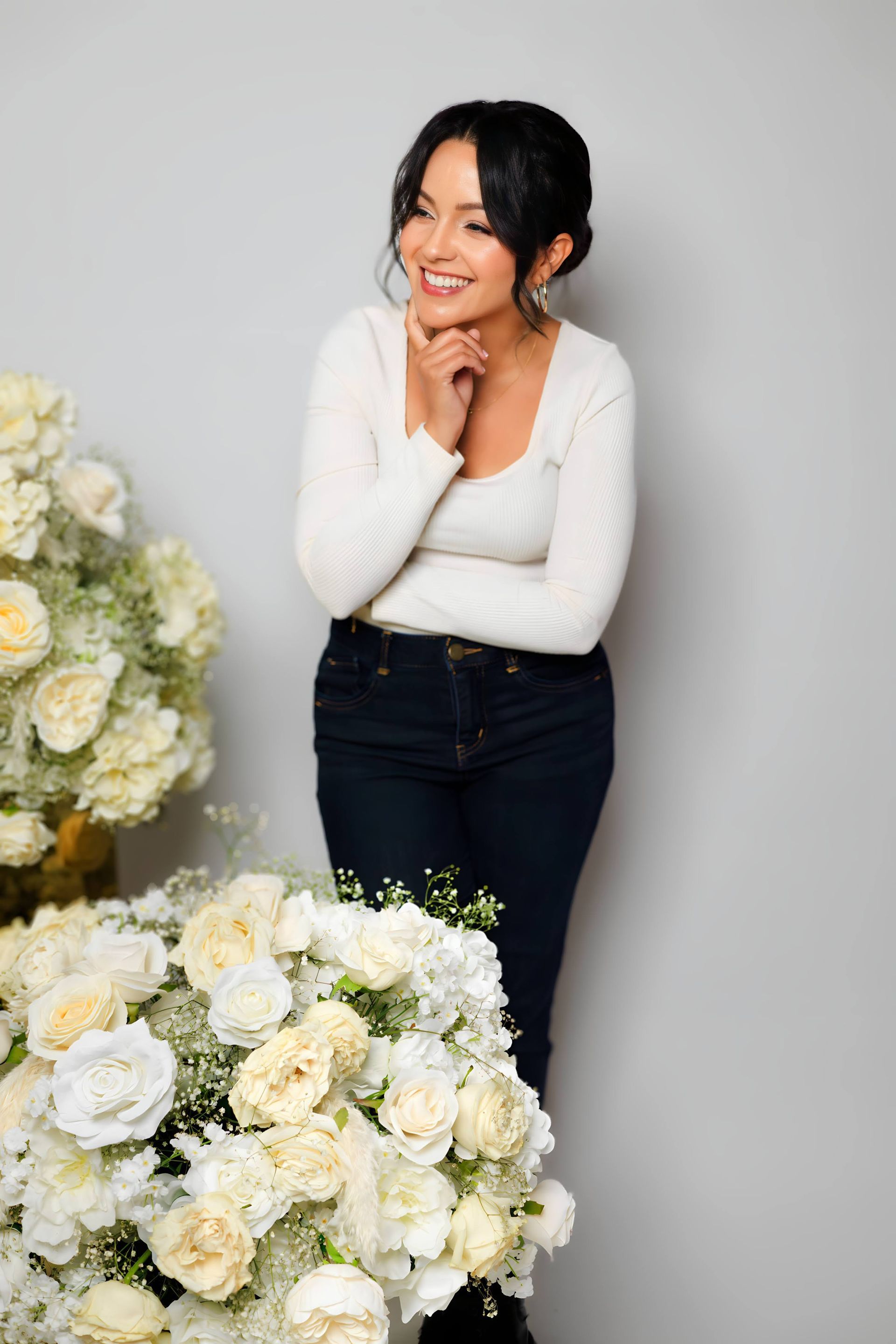 A bride and her bridesmaids are posing for a picture. fresh florals. bridal bouquet. bridesmaids bouquets. baby breath