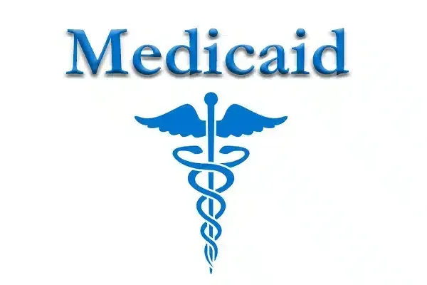 A blue caduceus with the word medicaid below it