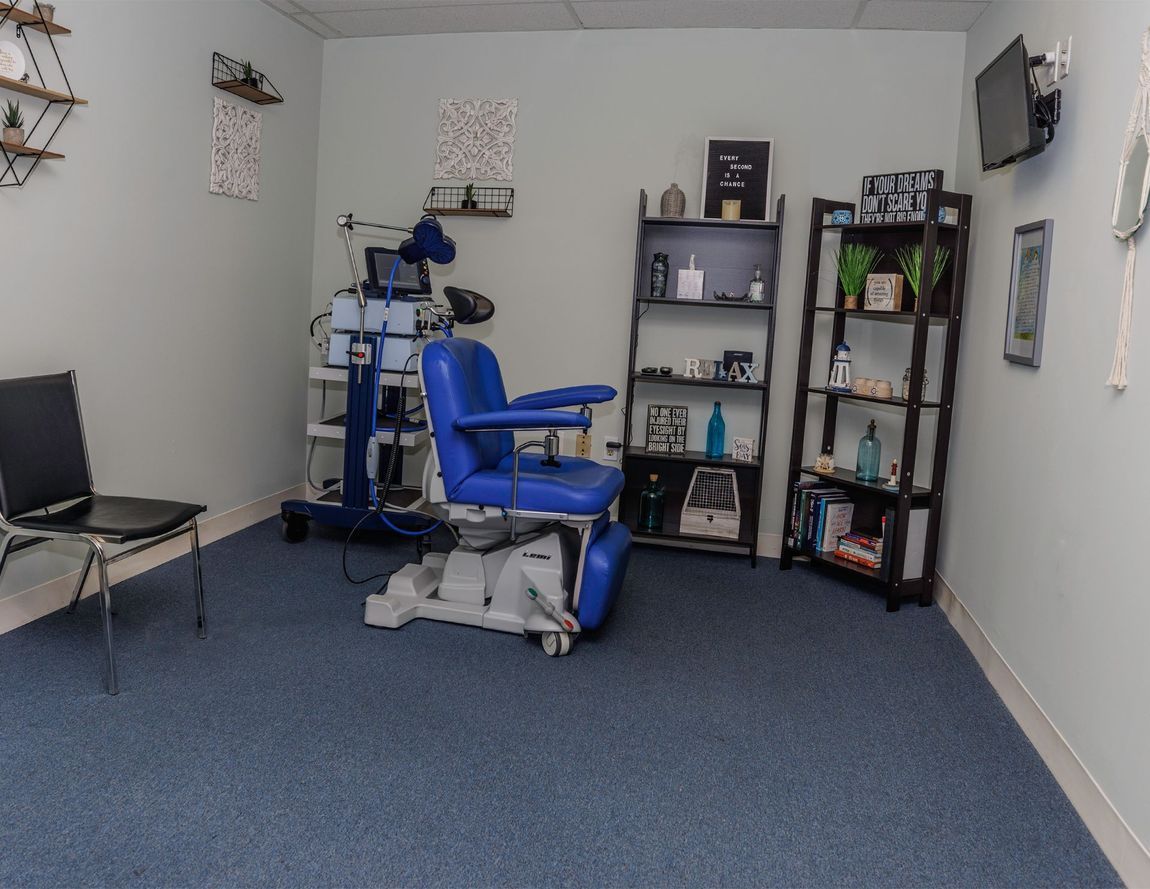 There is a blue chair in the middle of the room.