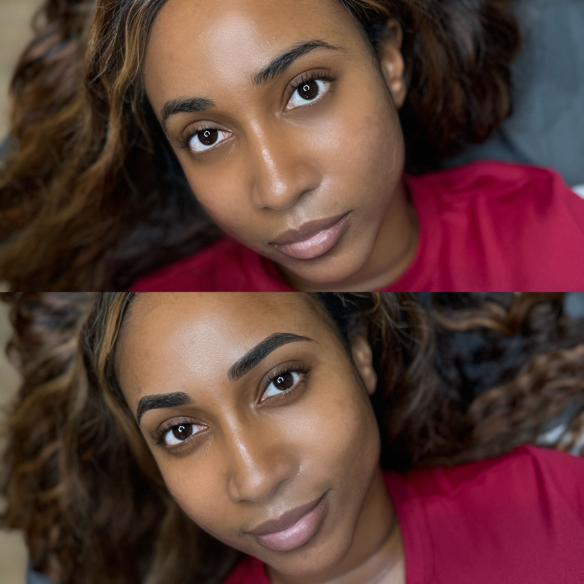 A woman in a red shirt is laying down and looking at the camera