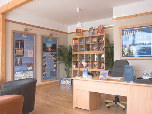 A room with a desk and a sign that says executive education centre