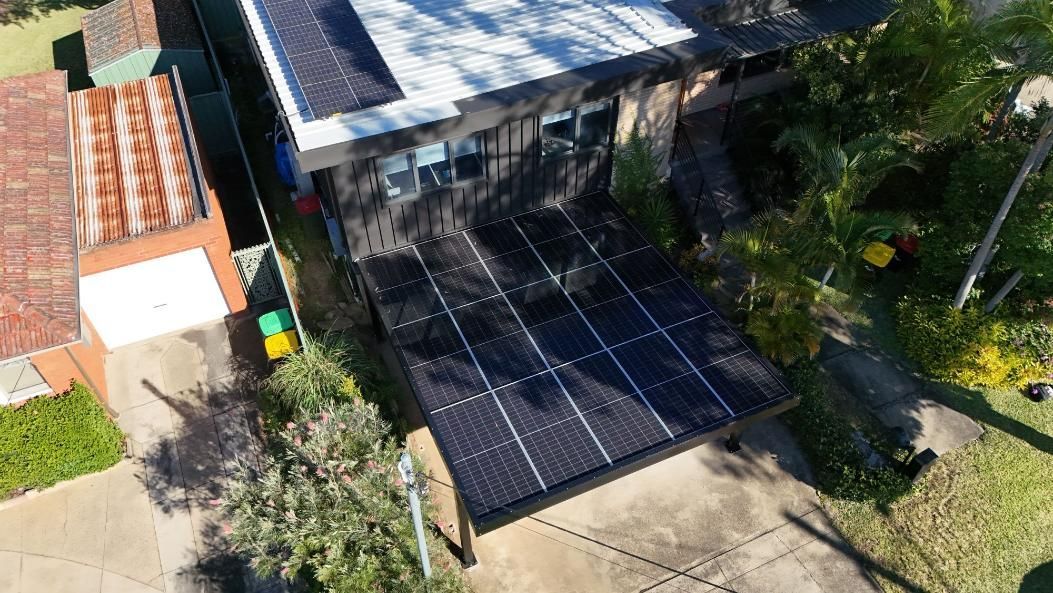Overhead View of A House with Solar Panels — Mid North Coast Solar Carports in Woolgoolga, NSW
