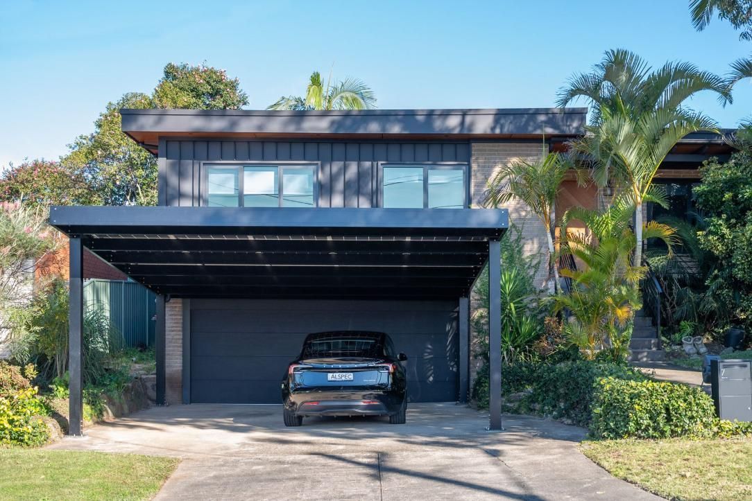 House With a Black Car in a Carport — Mid North Coast Solar Carports in Scotts Head, NSW