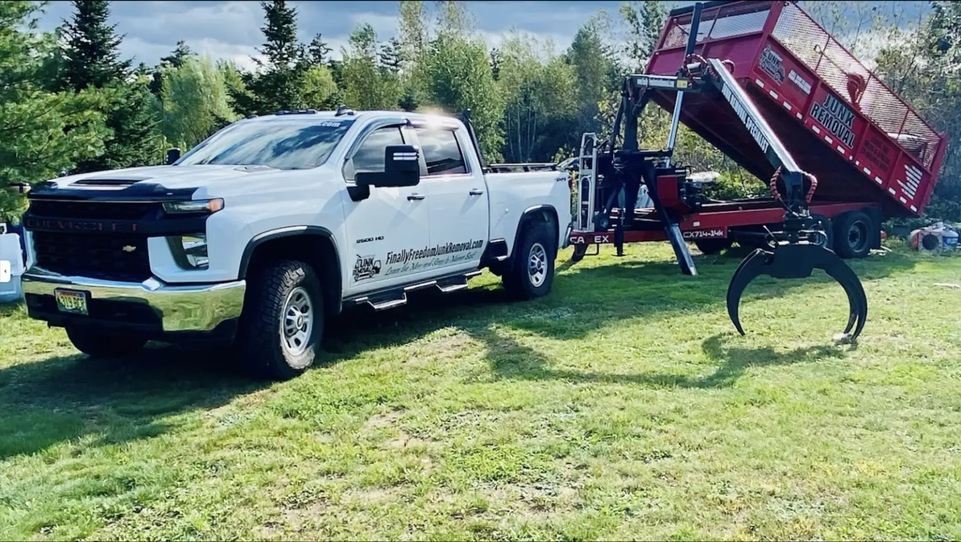 Finally Freedom Junk Removal's truck and crane.