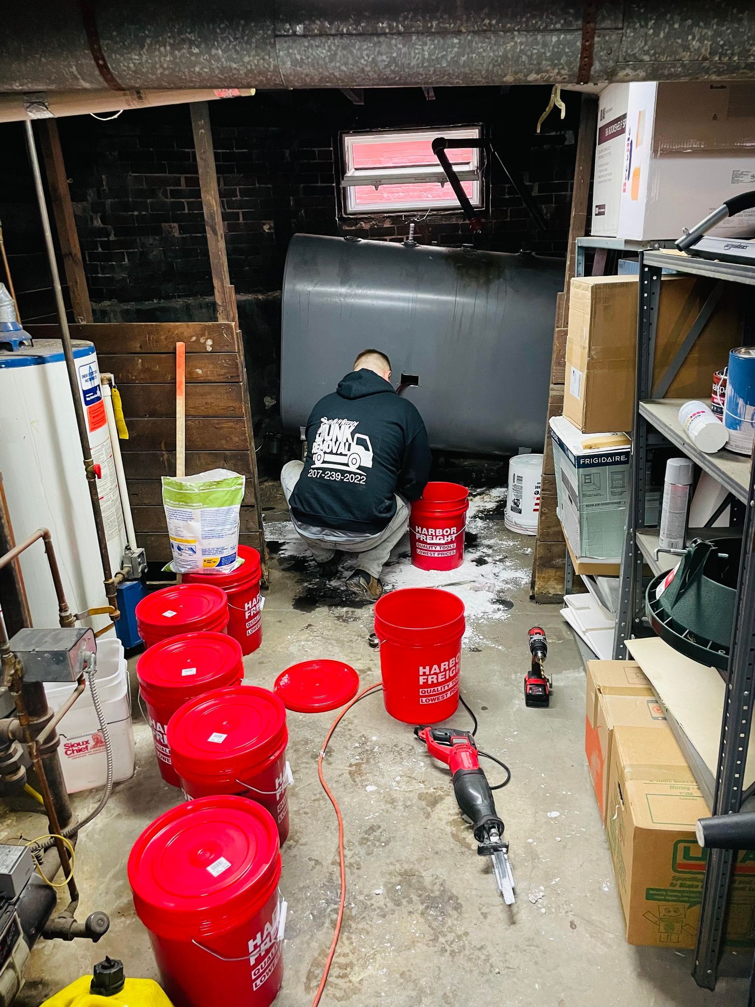 garage cleanout with metal tank removal