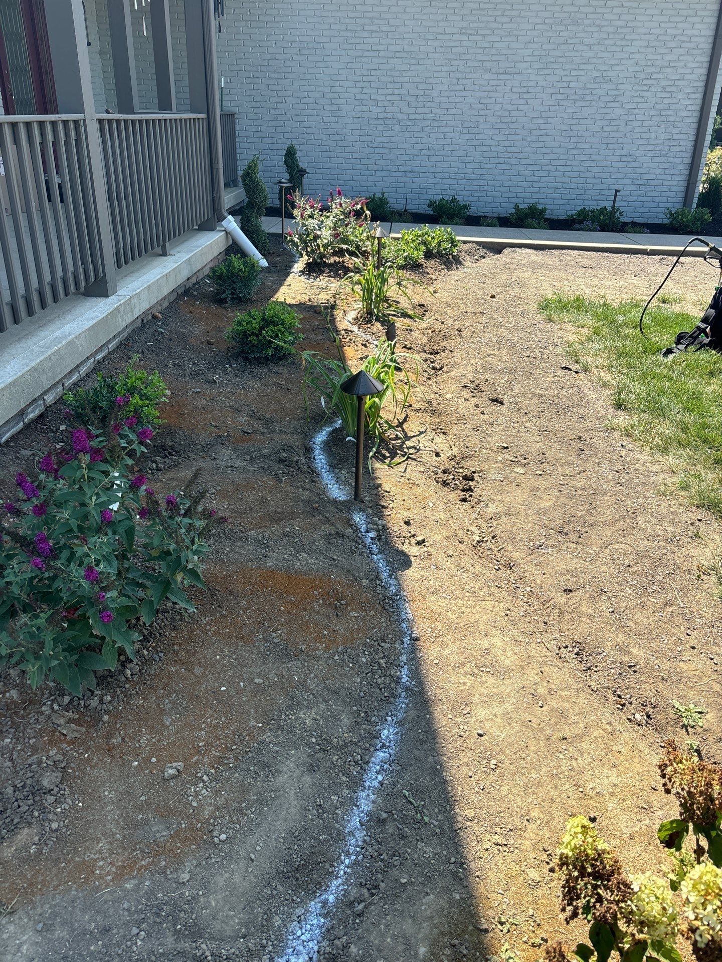 There is a drain in the middle of the yard.