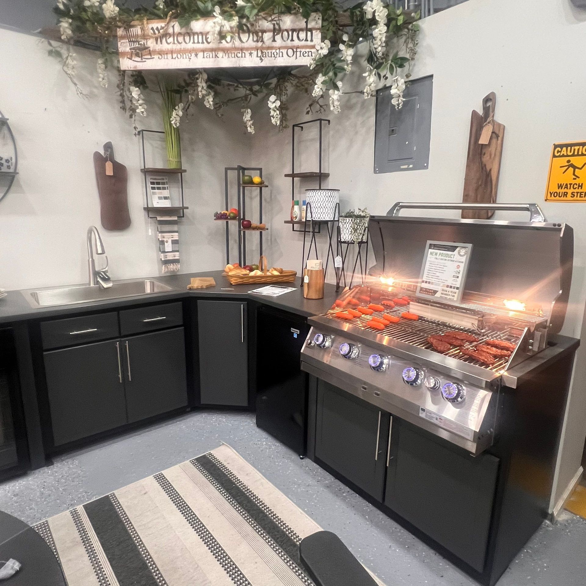 A kitchen with a sign that says welcome to our world