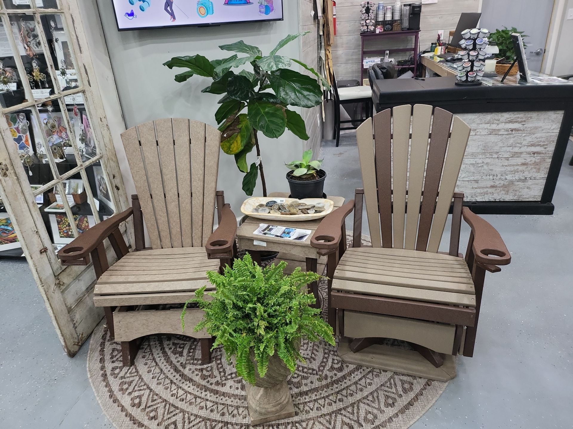 A couple of chairs sitting next to each other on a rug in a room.