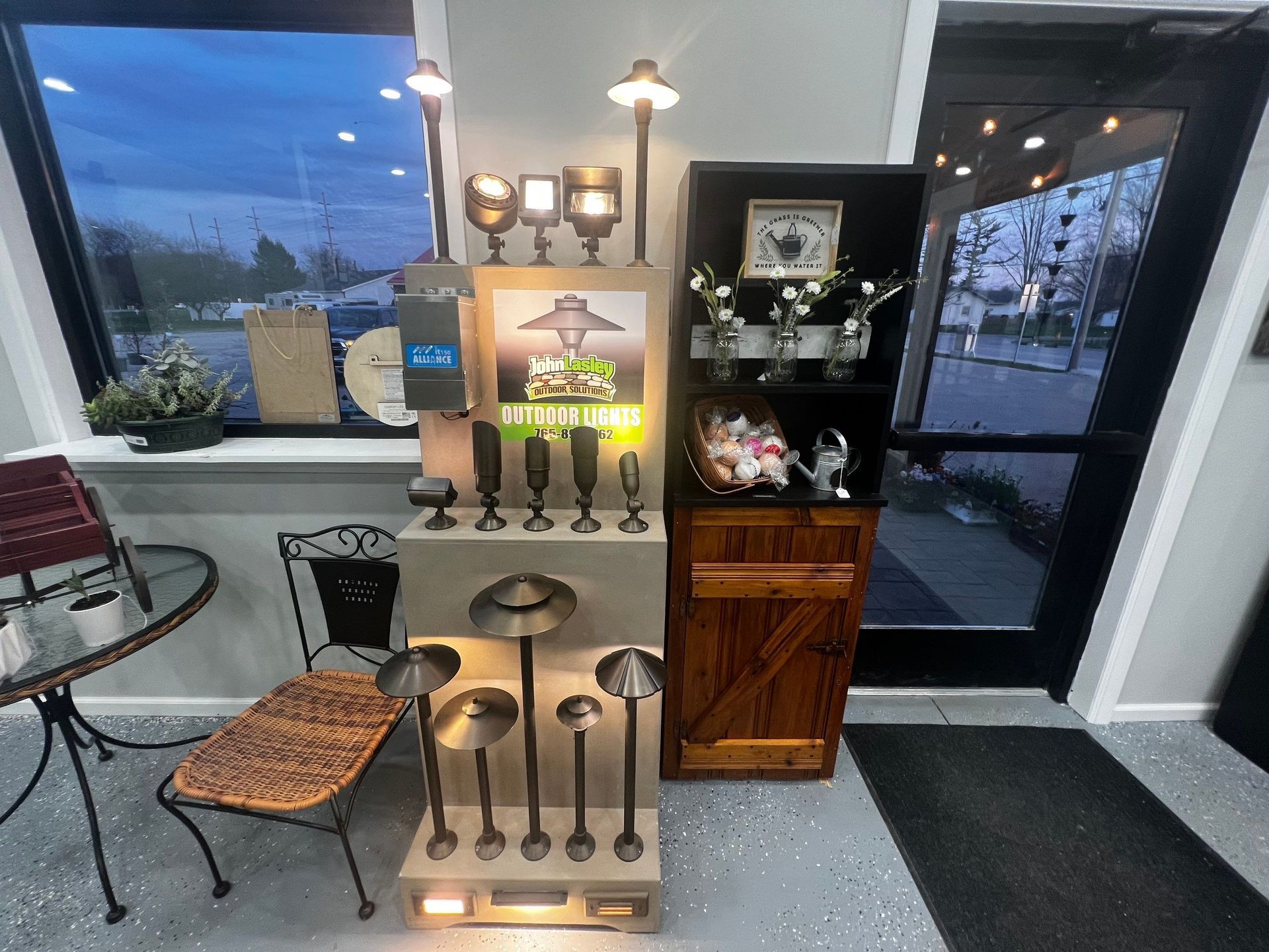 A room with a table and chairs and a display of lights.
