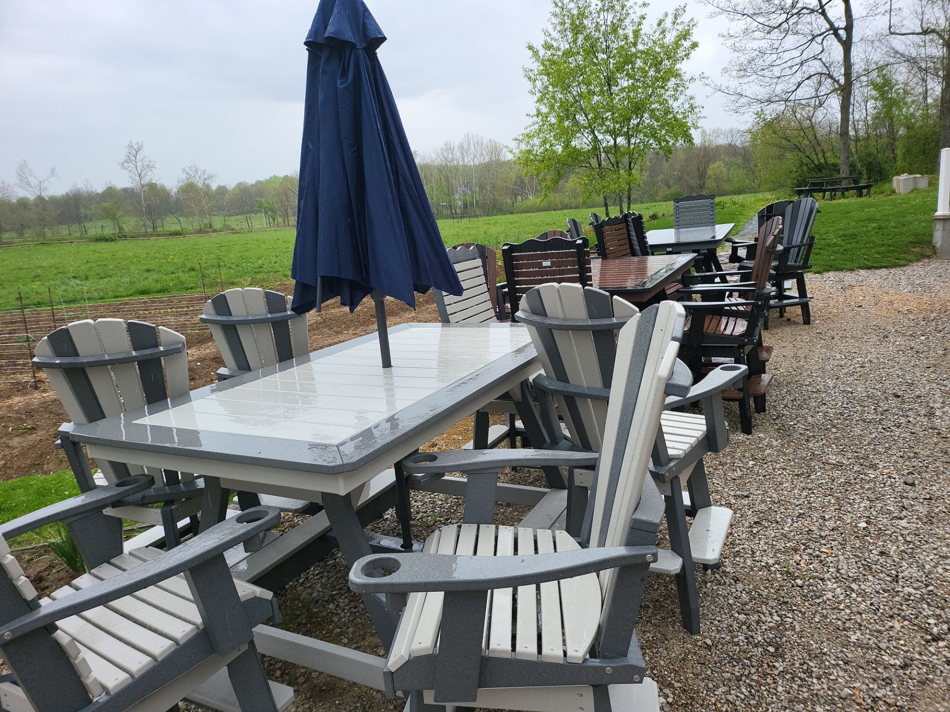 A patio set with a table and chairs and an umbrella