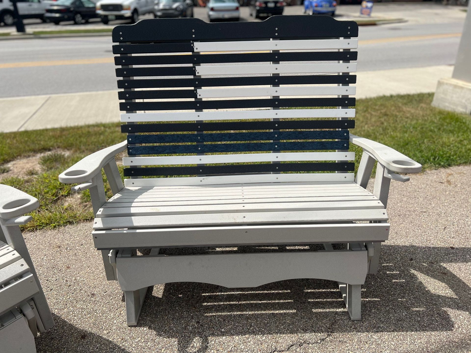 A wooden chair with a black and white american flag painted on it