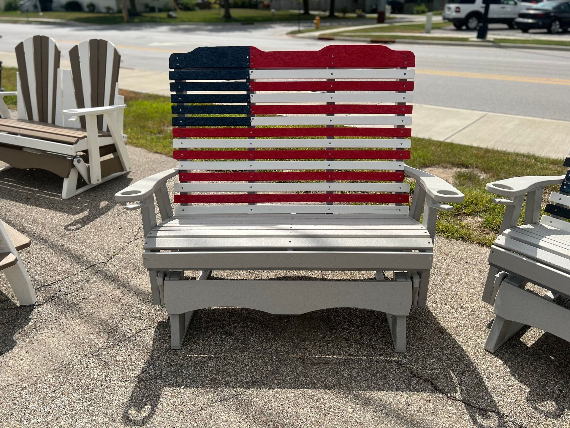 A wooden bench with an american flag painted on it