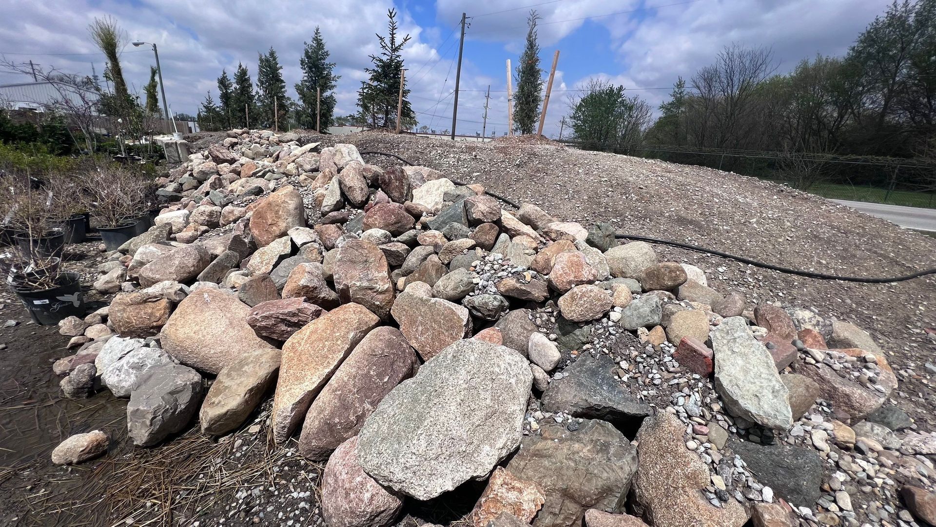 A pile of rocks on the side of a road.