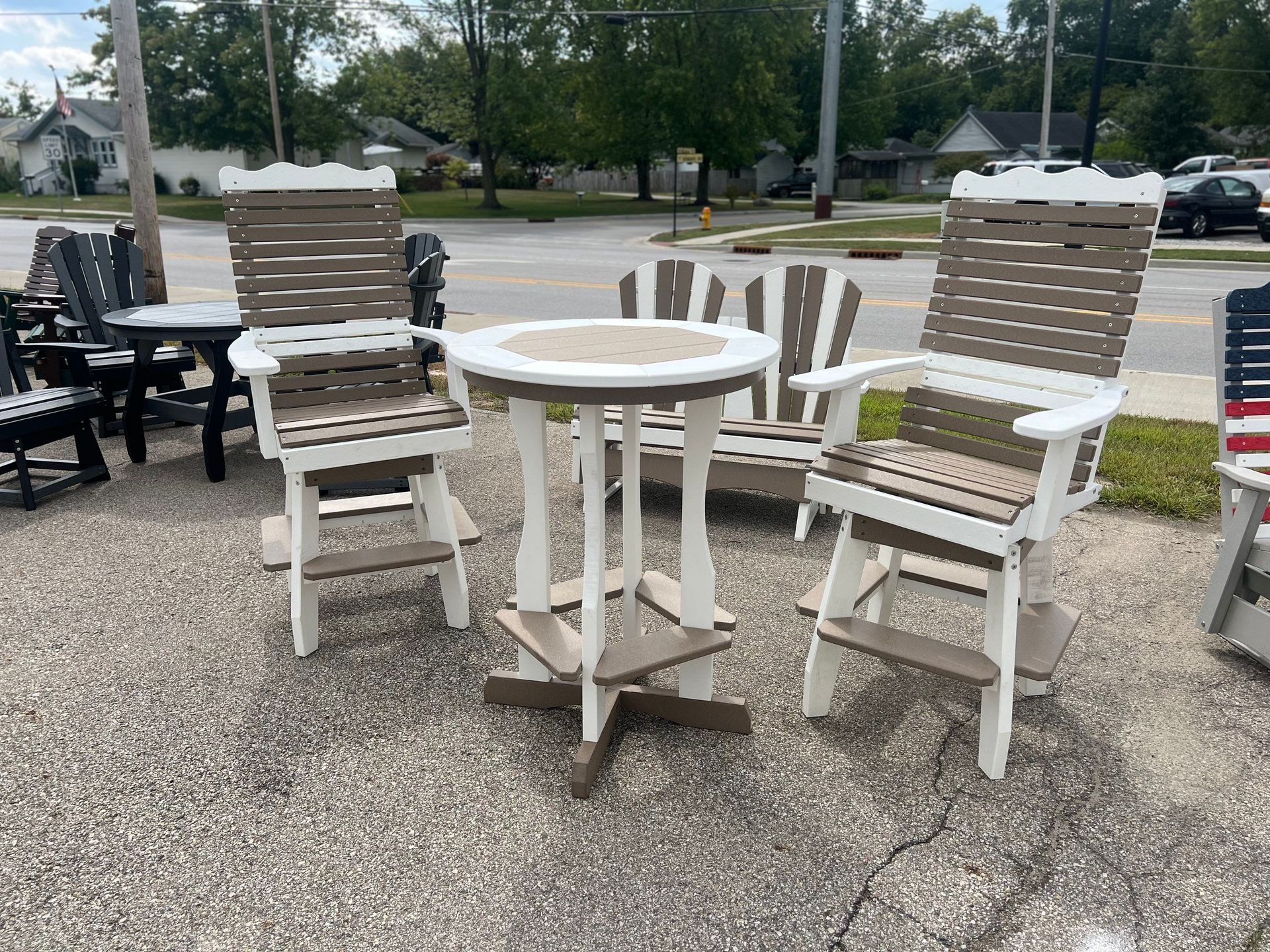 A table and chairs are sitting on the side of the road.