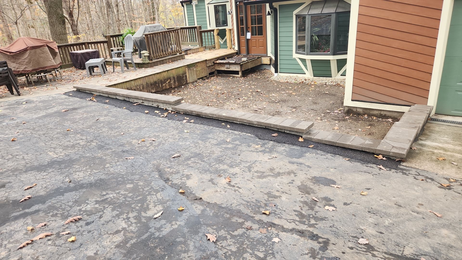 A house with a dog standing in front of it.