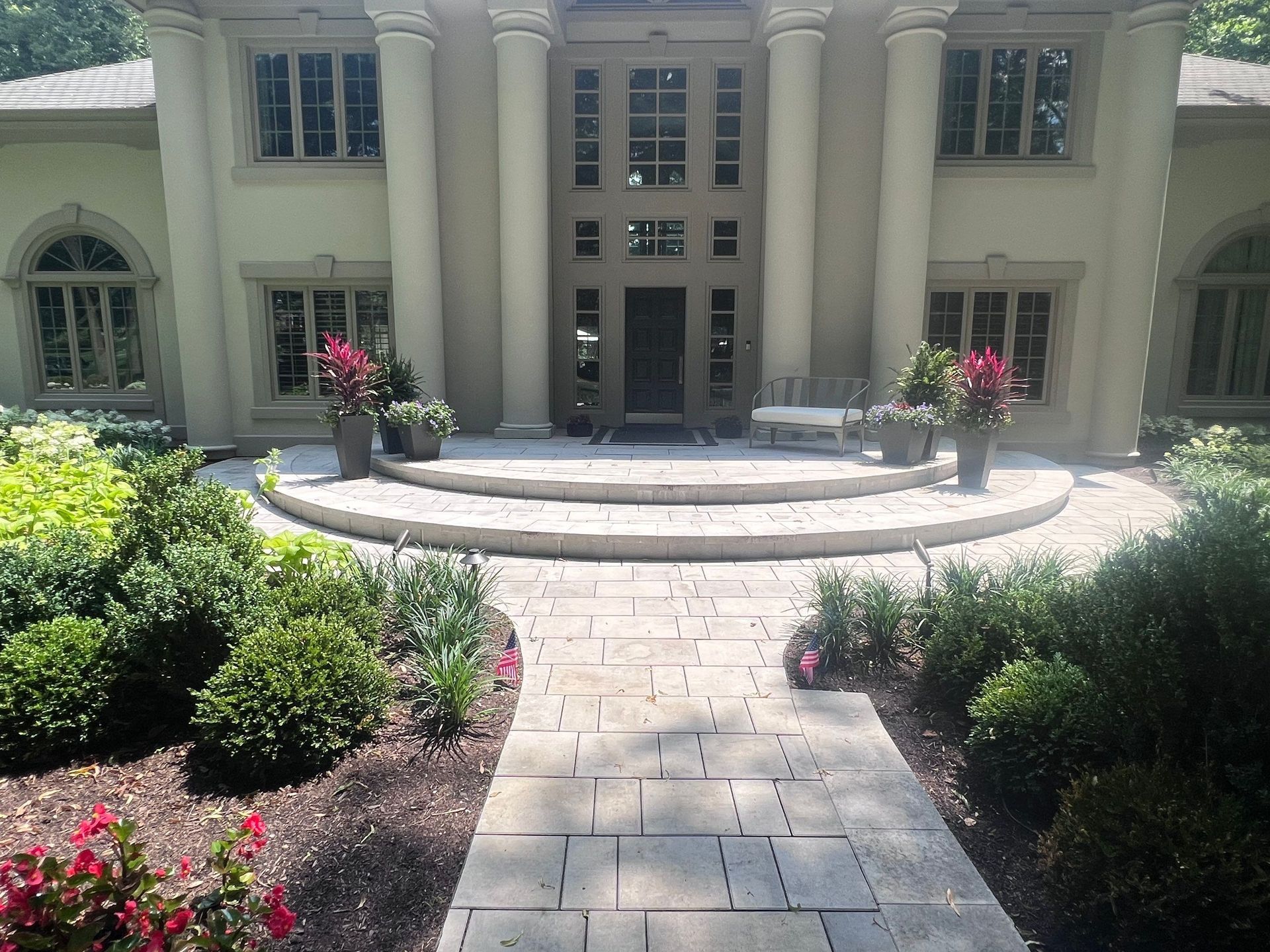 A large house with a walkway leading to it