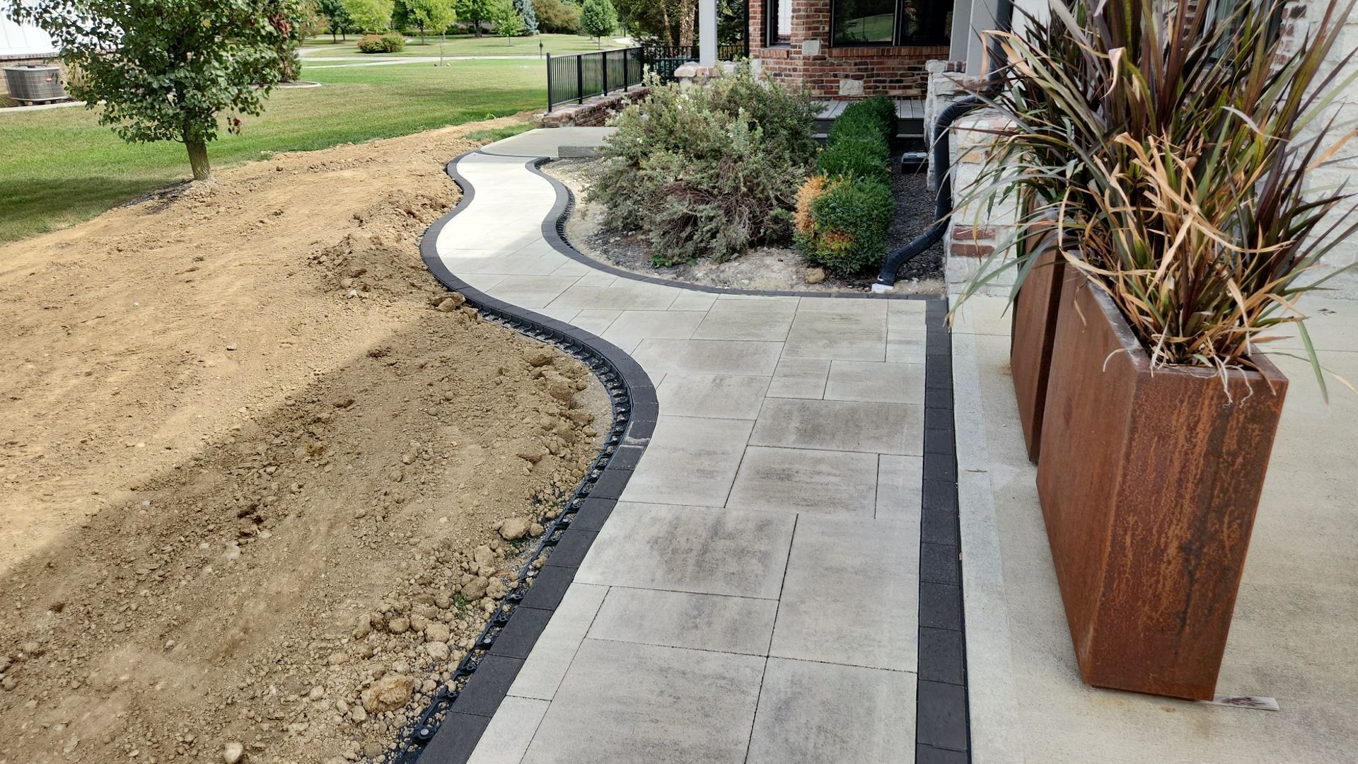 A walkway is being built in front of a house.