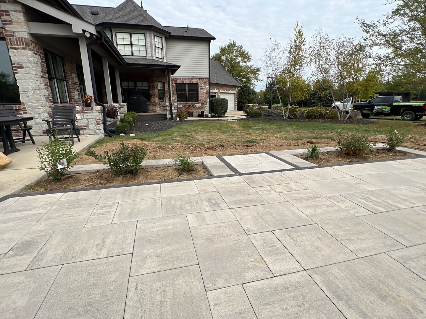 A large house with a large patio in front of it.