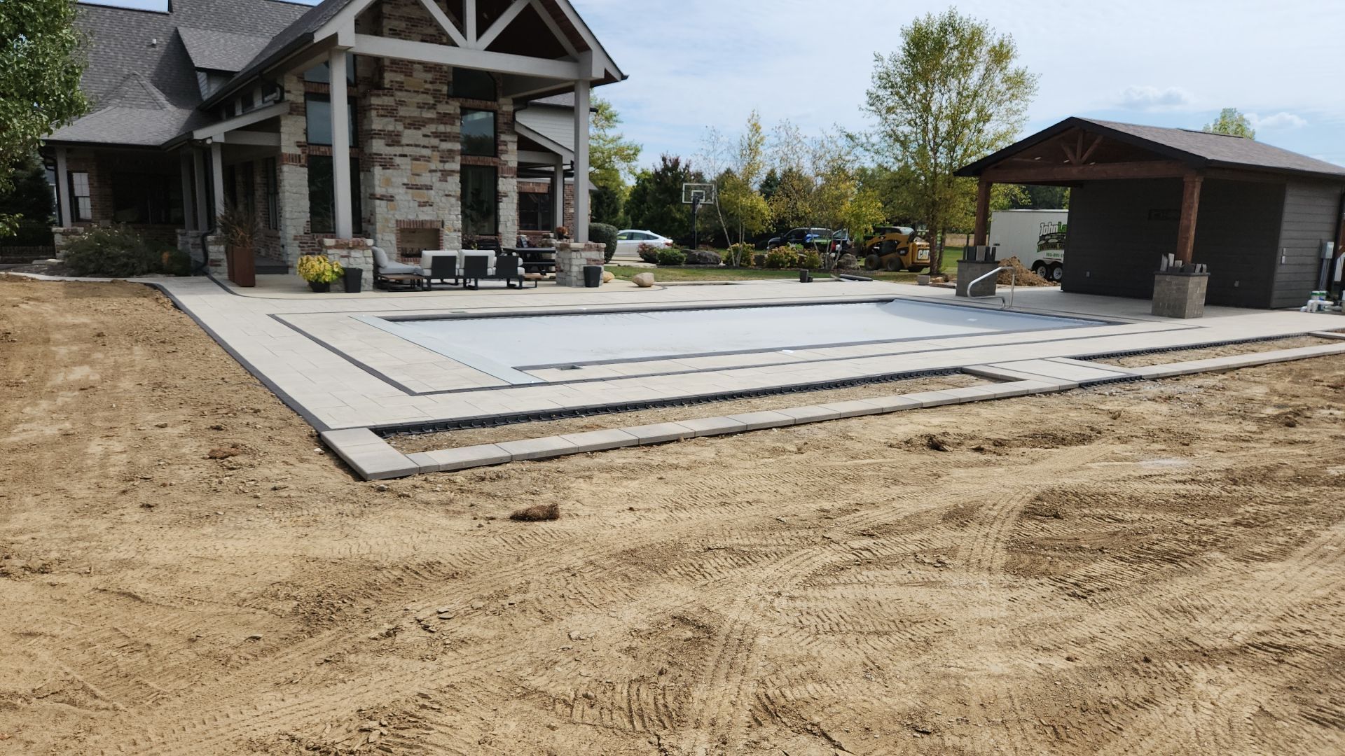 A large house with a large swimming pool in the backyard.