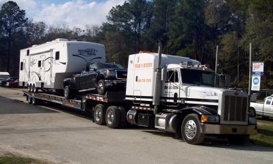 Automotive Repair Professionals — Vehicle on Tow Truck in Lake City, FL