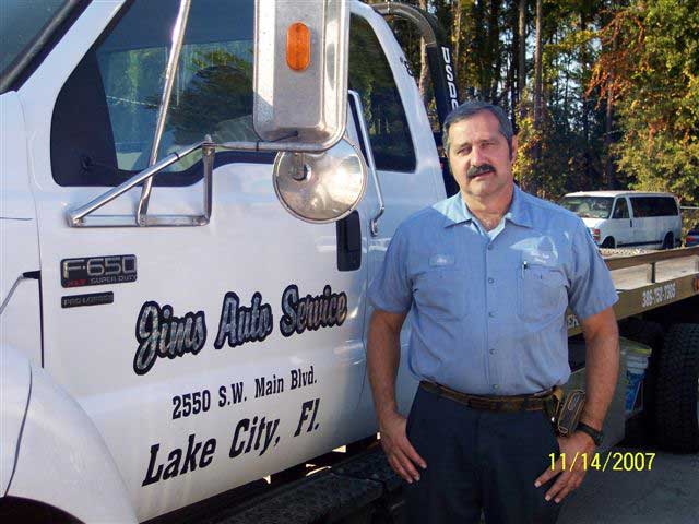 Towing Professionals — Man with Truck in Lake City, FL