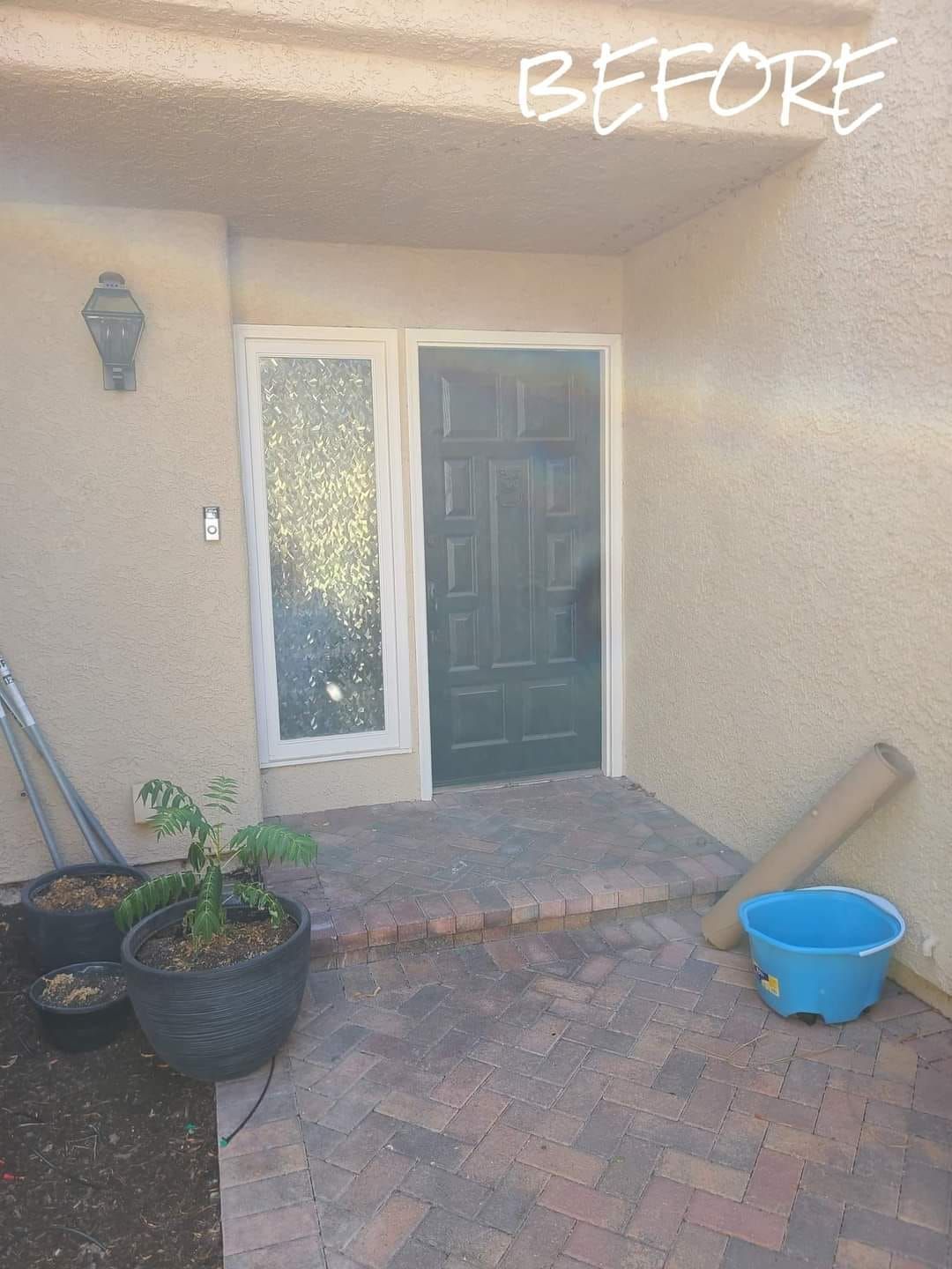A before picture of a house with a green door