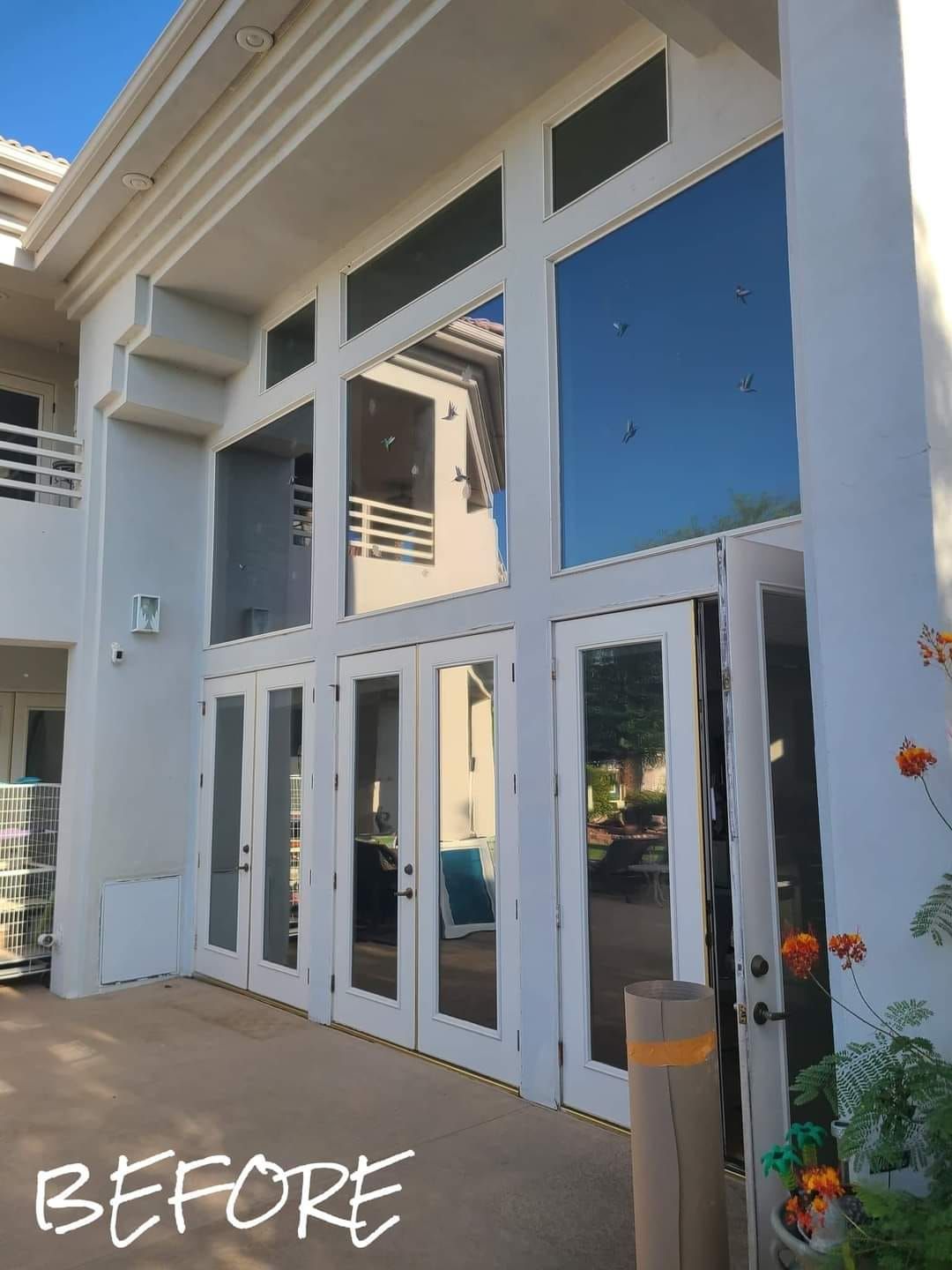 A before picture of a house with a lot of windows