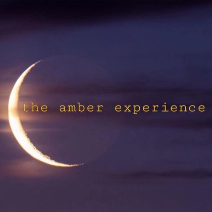 A crescent moon with the words the amber experience below it