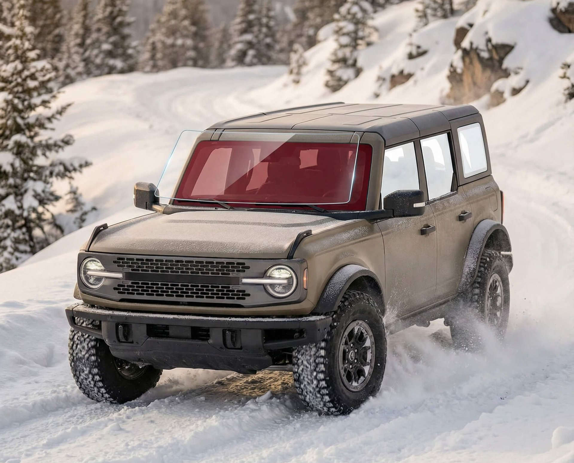 A person uses a heat gun to apply tint to a car window.