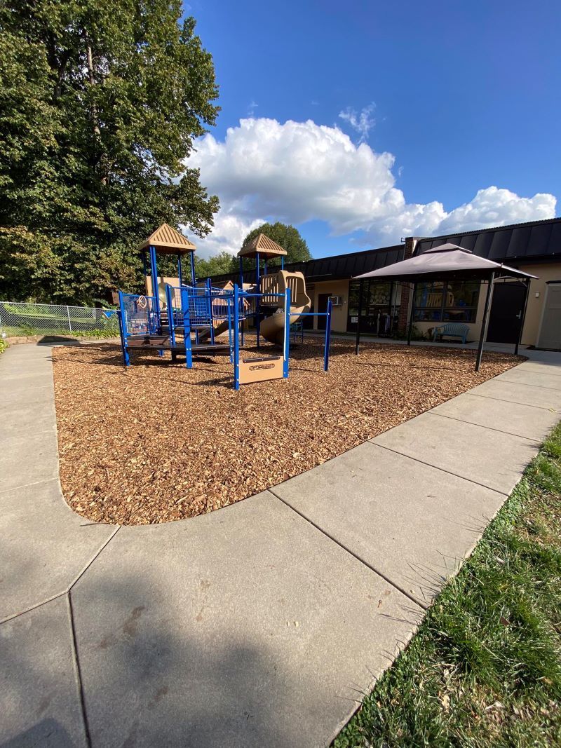 Picture of a mulch installation for a playground in Wayzata, MN. You can see a small playgorund at a local day care here in Wayzta. You can  see mulch covering the surface of the playgound floor. 