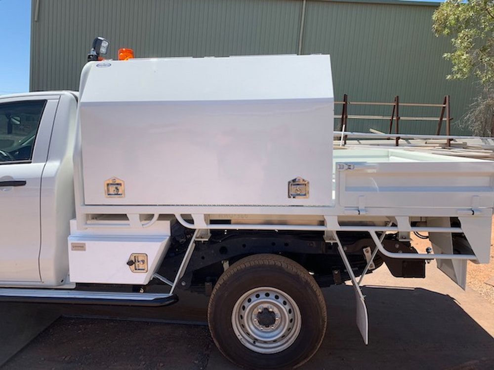 The Back of a White Car With Cover in It — Wright's Welding Operations In Ryan, QLD