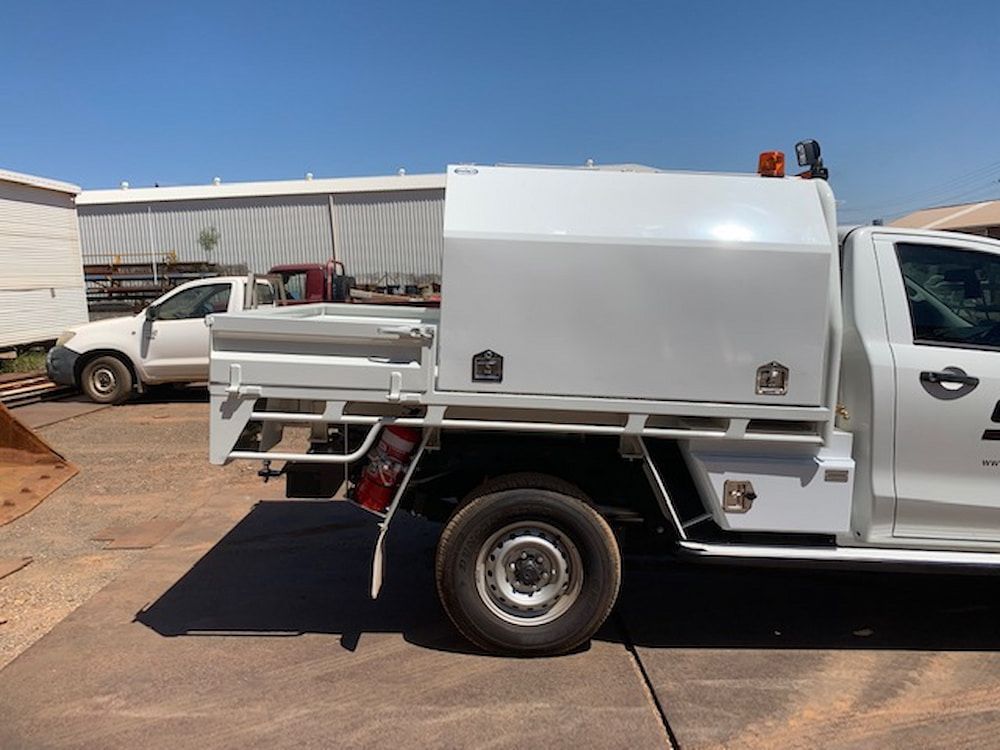 A White Truck is Parked on the Side of the Road — Wright's Welding Operations In Ryan, QLD