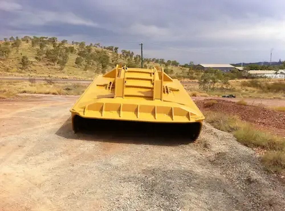 A Large Yellow Metal Next to the Road — Wright's Welding Operations In Ryan, QLD