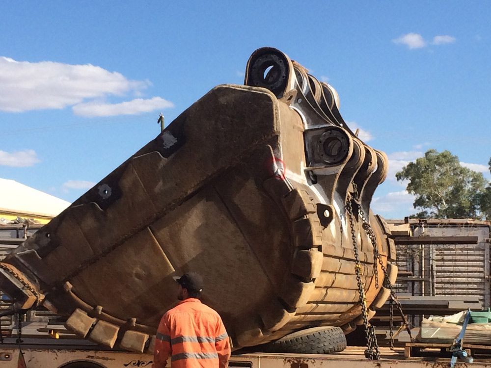 Big Bucket Loading On The Truck — Wright's Welding Operations In Ryan, QLD