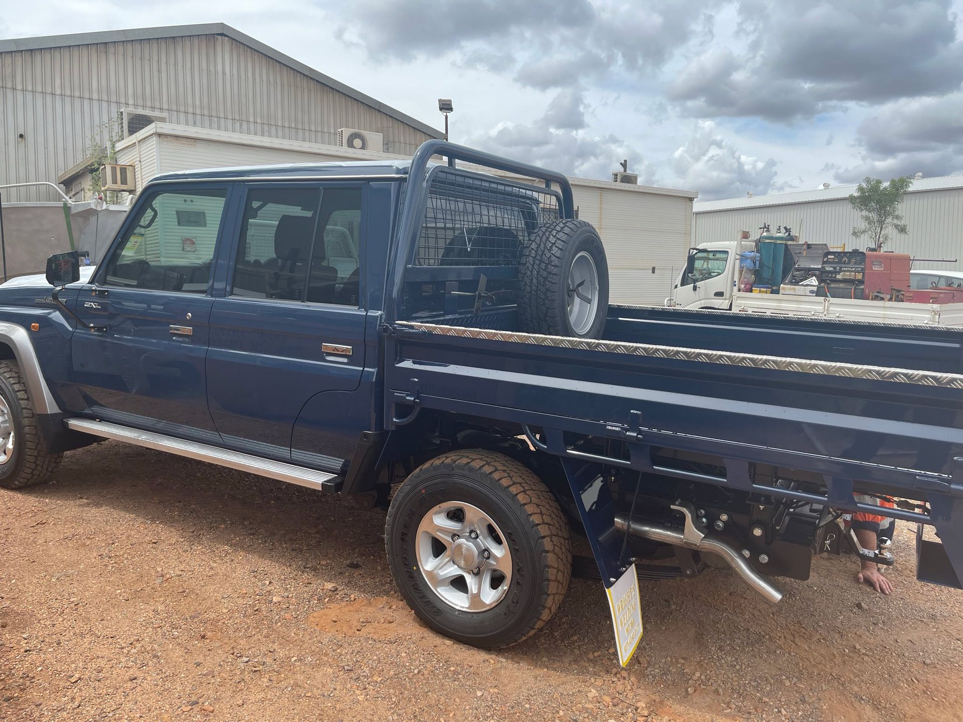 Dark Blue Pick Up With Tray — Wright's Welding Operations In Ryan, QLD