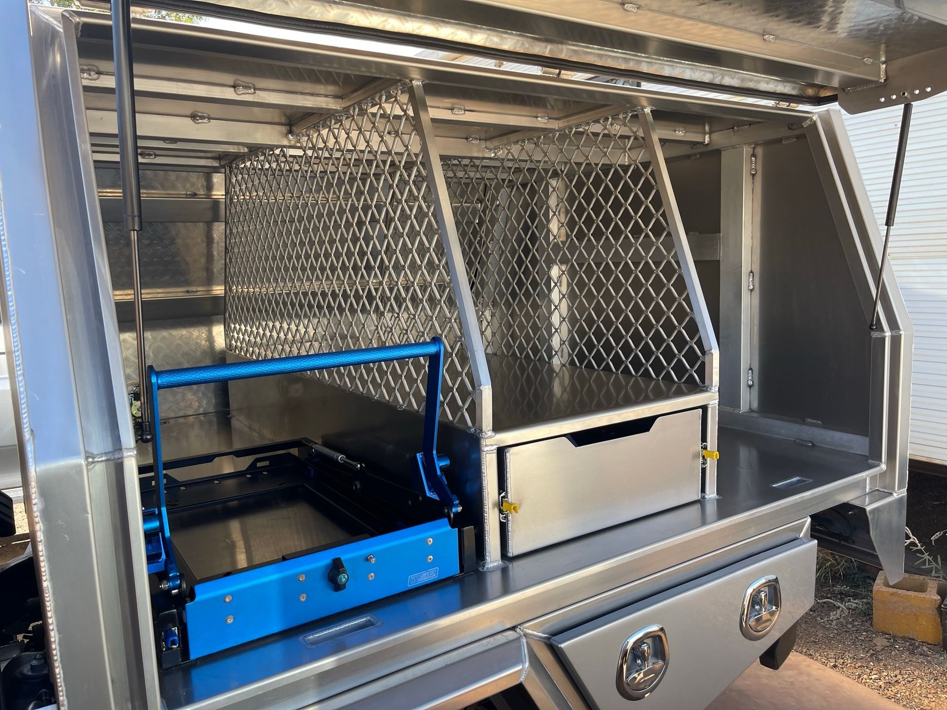 Man Sitting On The Canopy Display — Wright's Welding Operations In Ryan, QLD
