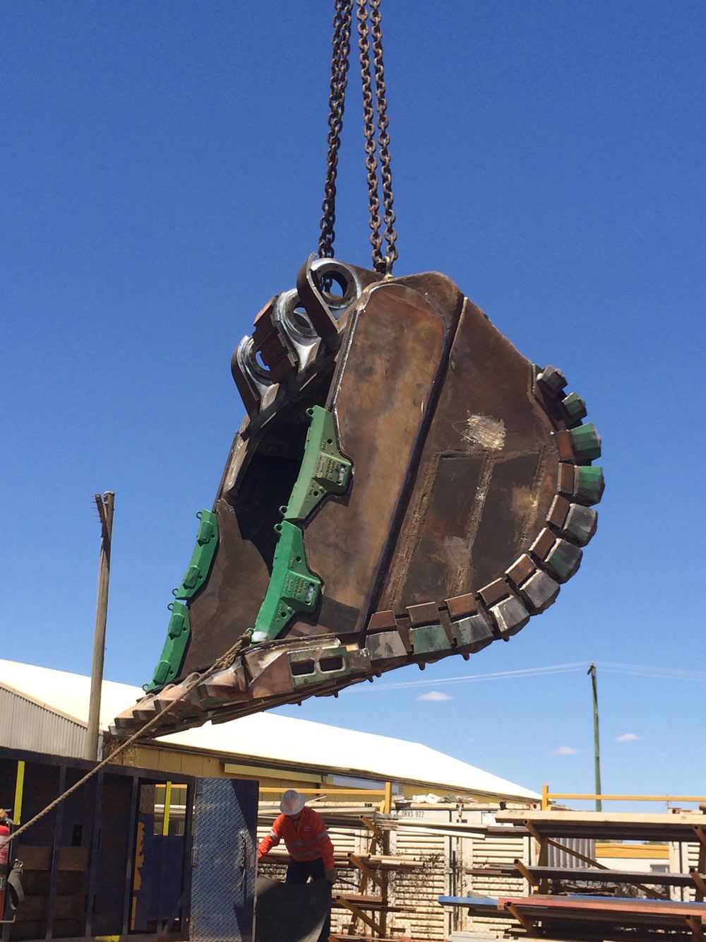 Men Workers Lifting Up The Big Bucket — Wright's Welding Operations In Ryan, QLD