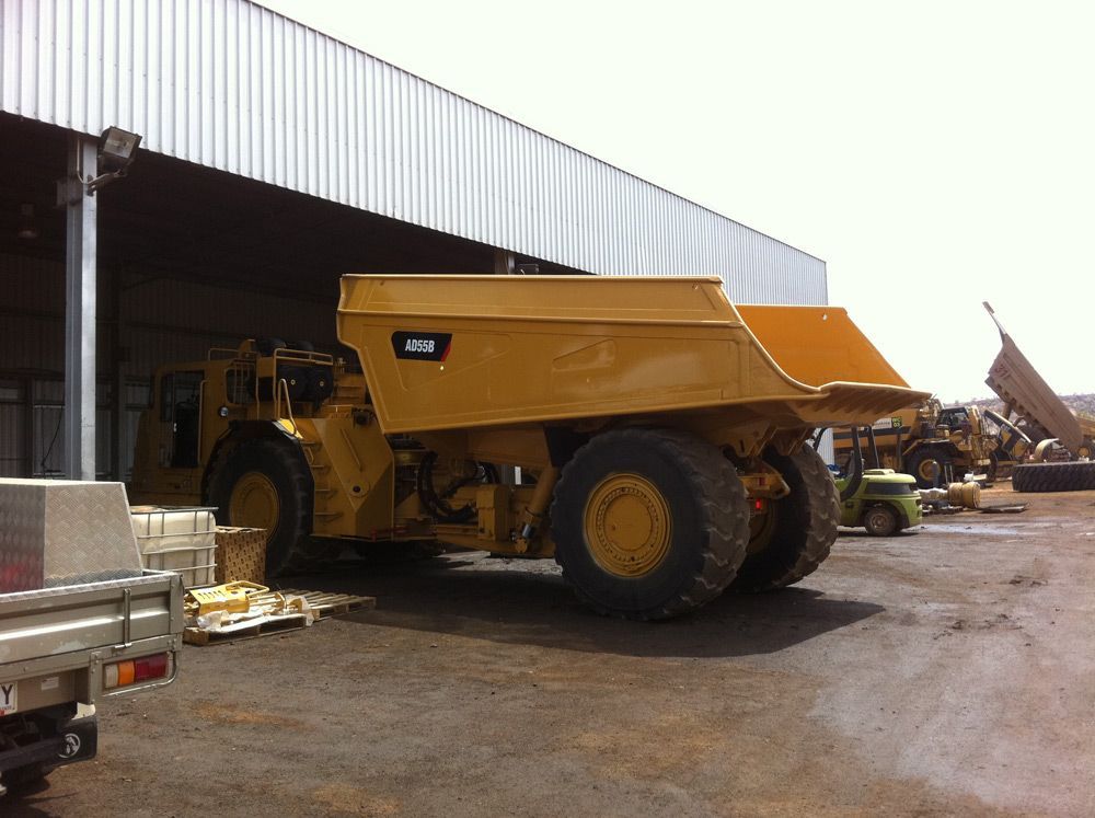 Yellow Heavy Equipment At The Welding Shop — Wright's Welding Operations In Ryan, QLD