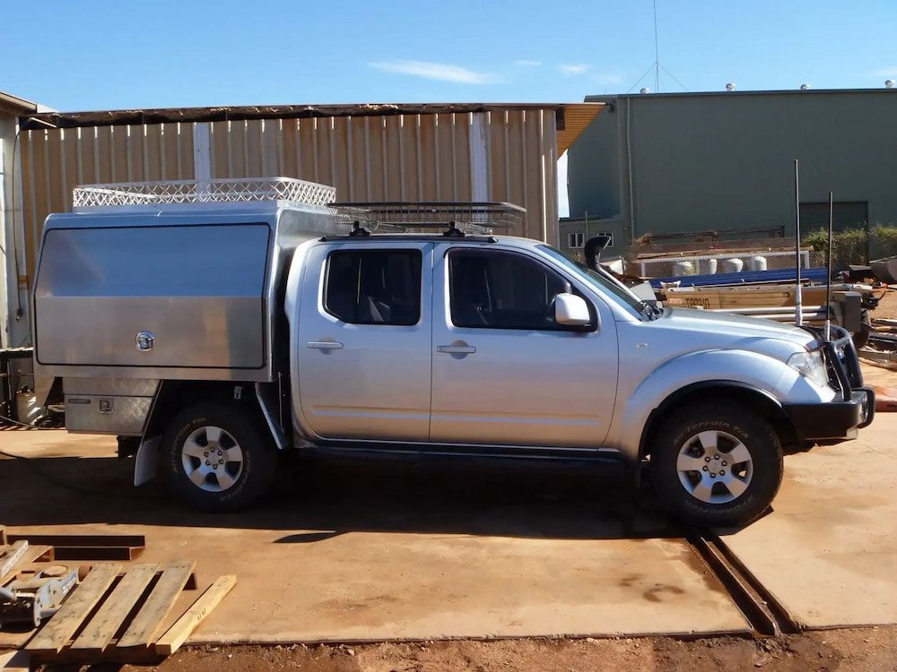 A Silver Truck With a Canopy is Parked in Front of a Building — Wright's Welding Operations In Ryan, QLD
