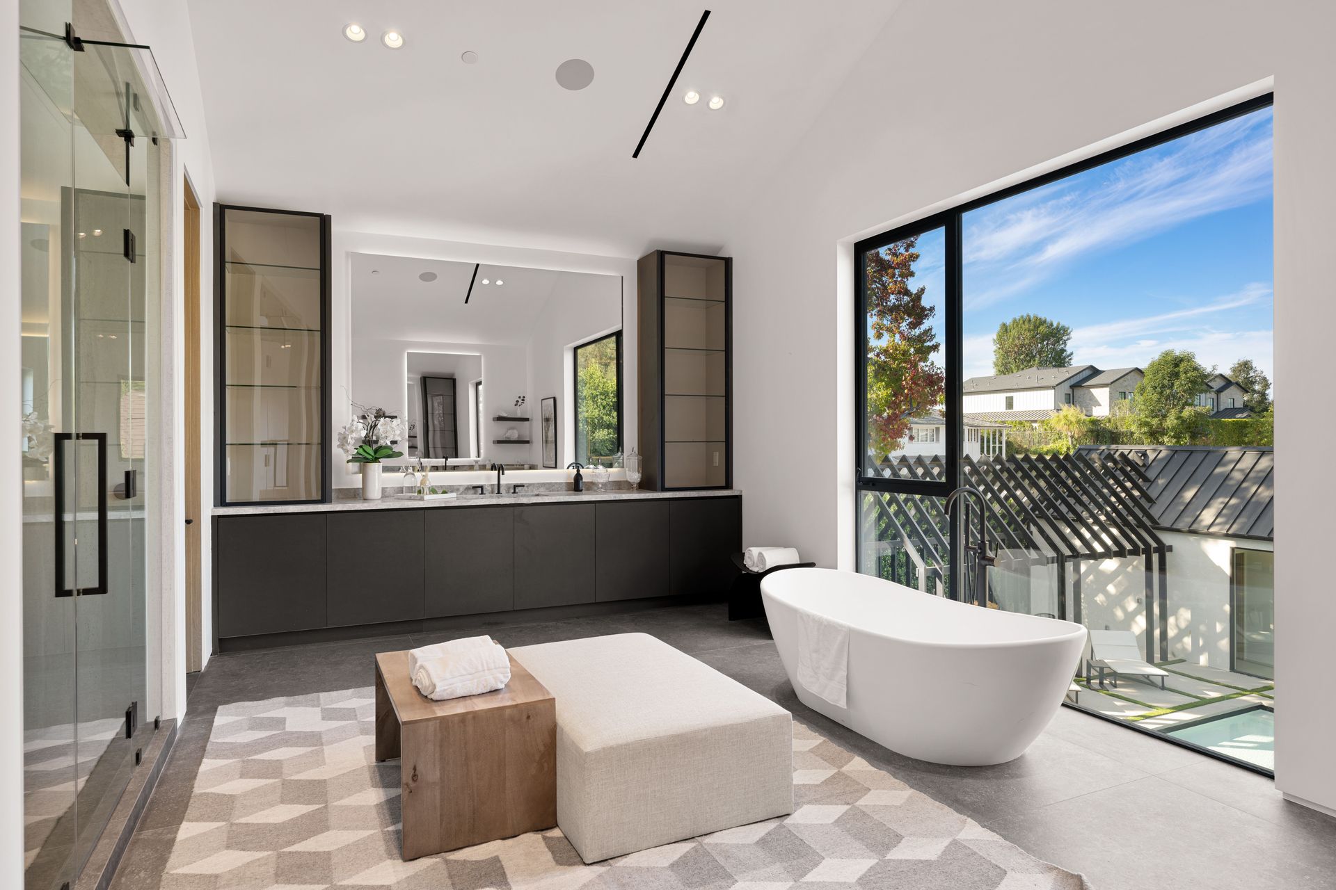 A bathroom with a bathtub and a large window. Gayle Morris Real Estate | GUIDE Real Estate - Auburn, CA Real Estate