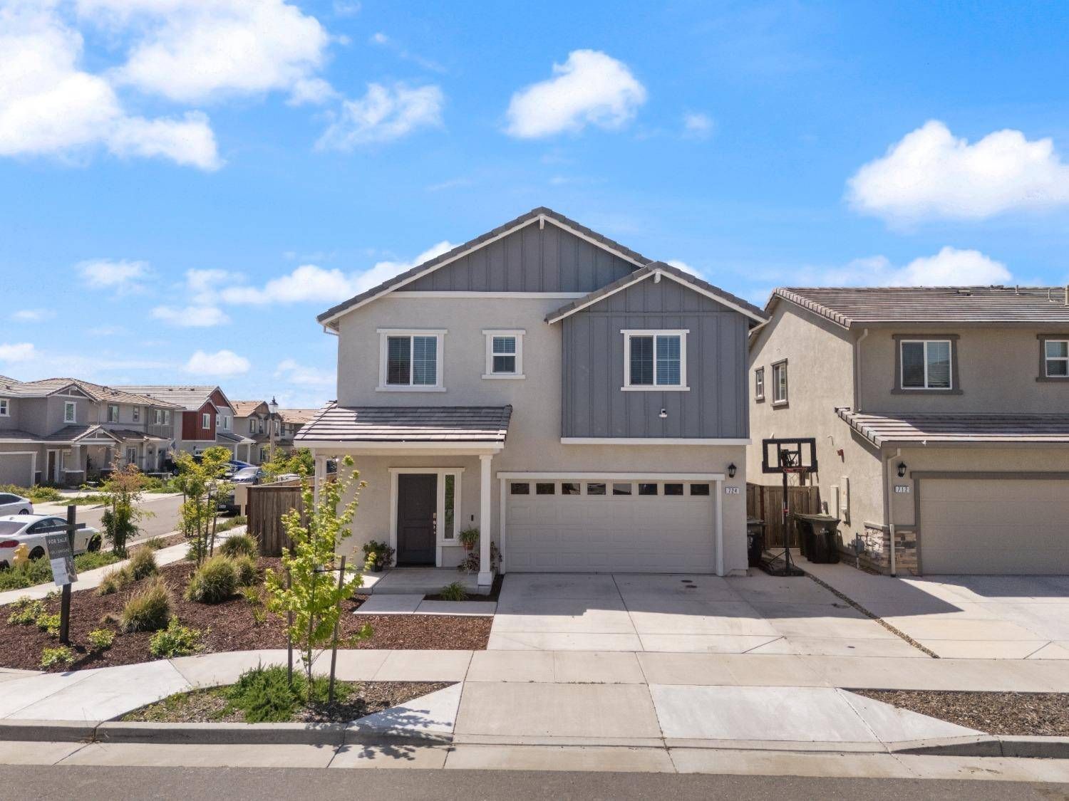 An aerial view of a house in a residential area
