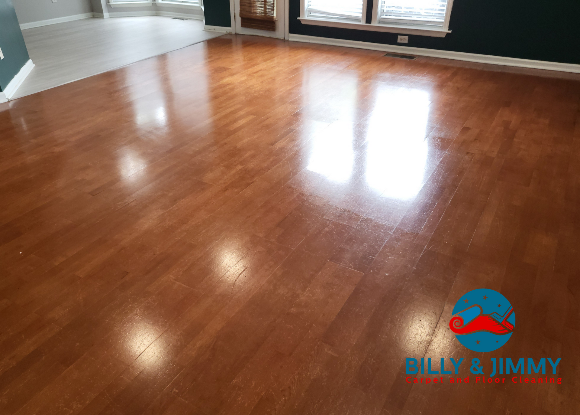a man is cleaning a tiled floor with a vacuum cleaner .