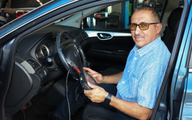 Person seated in a car | Omega Automotive