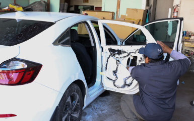 Mechanic working to a car | Omega Automotive