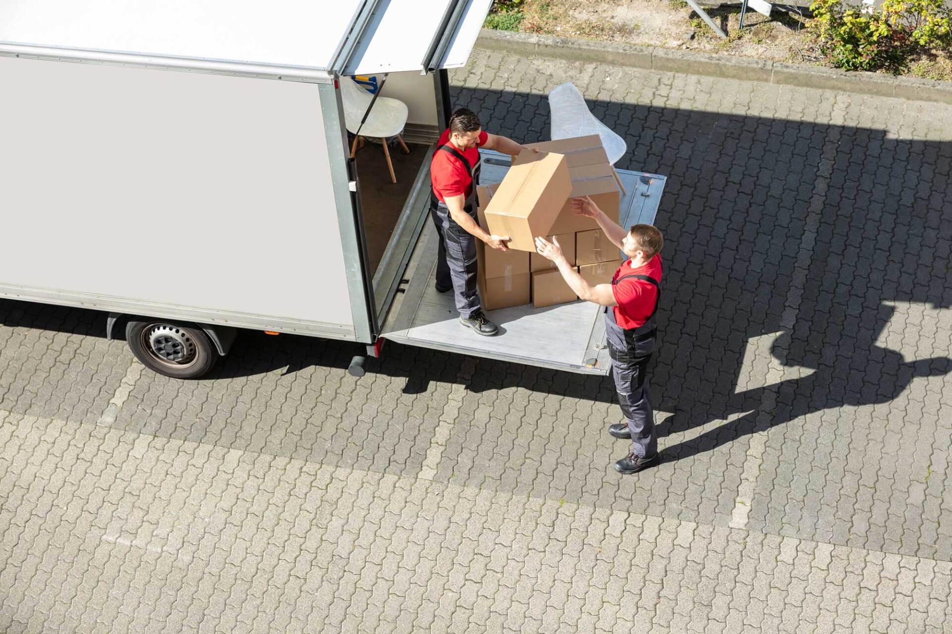 Movers Unloading the Cardboard Boxes from Truck — West Virginia — Watts Brothers Moving