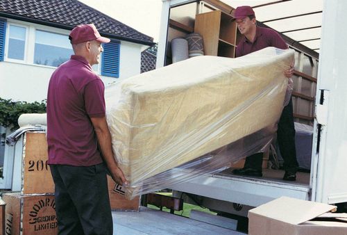 Movers Unloading Sofa — West Virginia — Watts Brothers Moving
