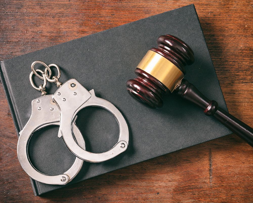 Handcuffs, Gavel on Book — Poteau, OK — Cowan Windrix Law
