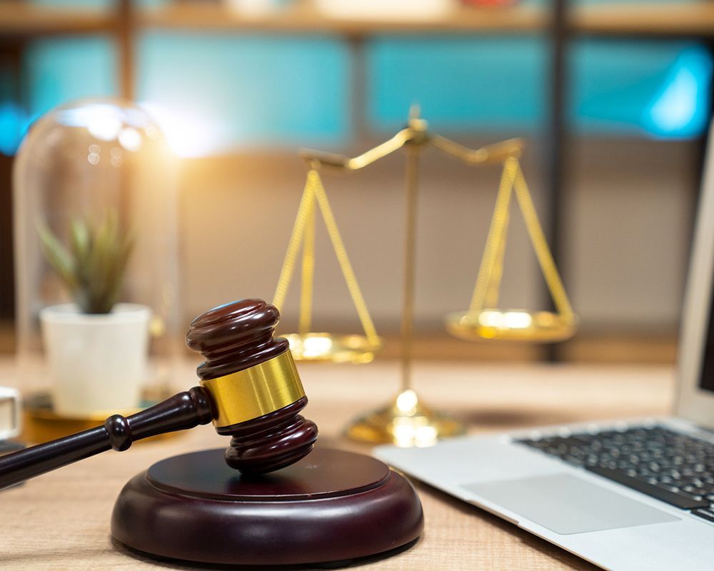 Gavel, Balance and Laptop — Poteau, OK — Cowan Windrix Law