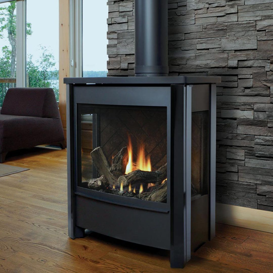 Black fireplace with flames, logs, glass panels, and a stone wall.