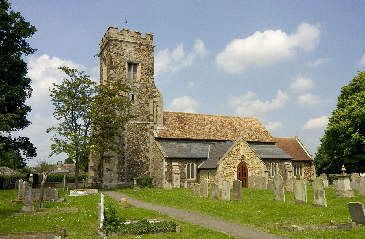 A church with a cemetery in front of it